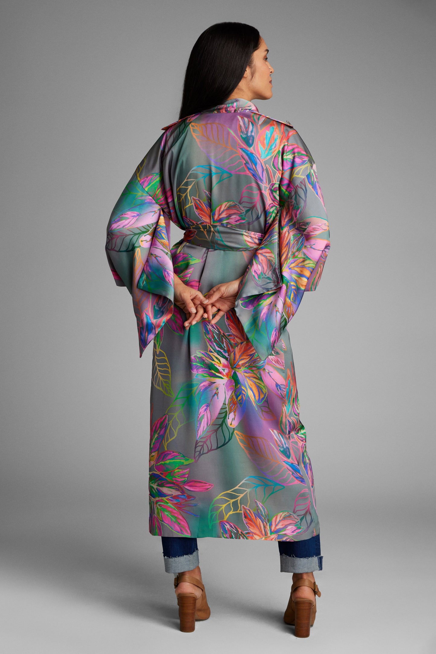 Back profile of woman modelling an all over tropical printed kimono duster made from recycled materials 2