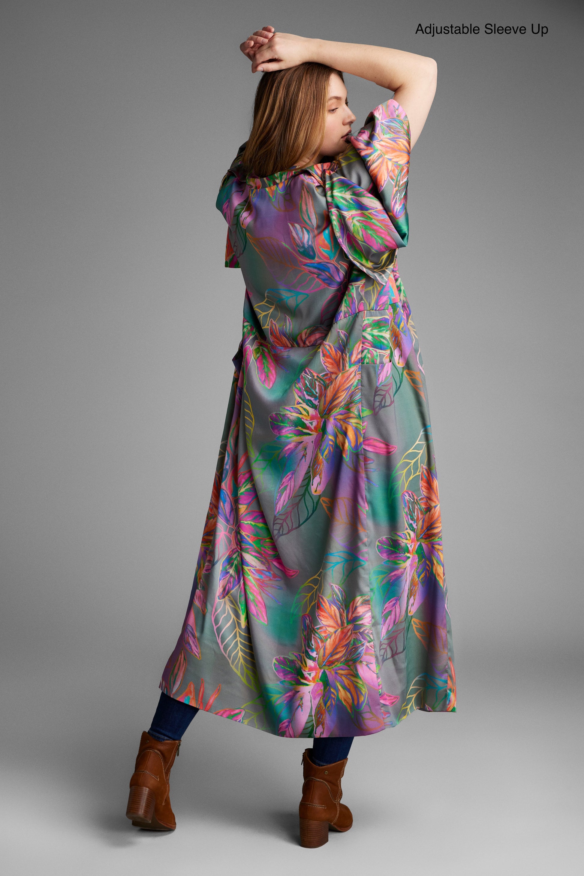 Back profile of woman modelling an all over tropical printed kimono duster made from recycled materials 3