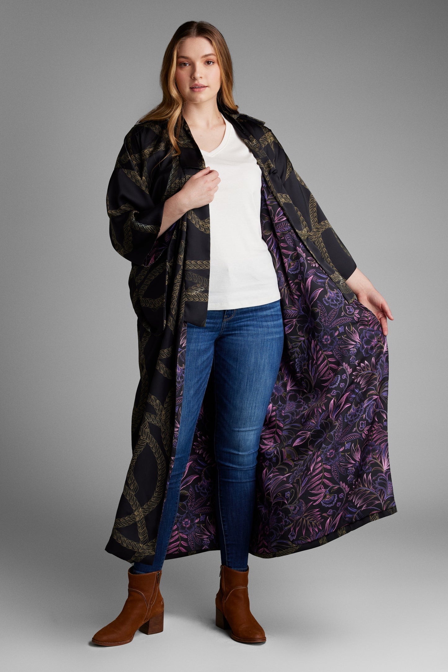 Woman modeling black and gold chain printed womens kimono duster made from recycled materials