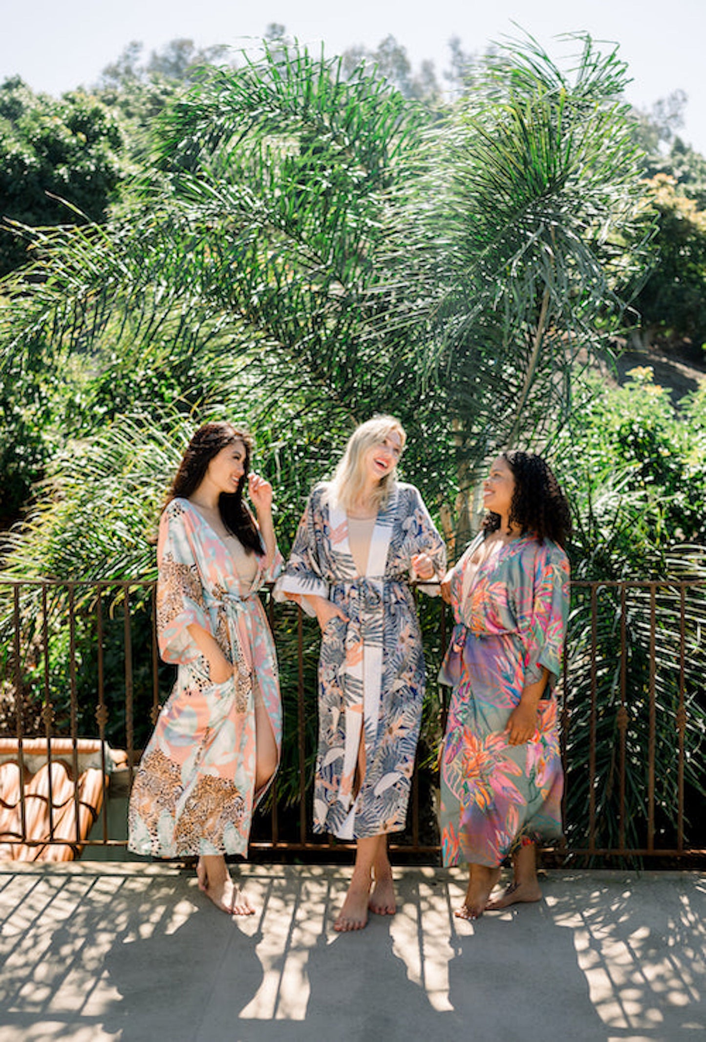 Three women wearing kimono robe in navy toucans outside