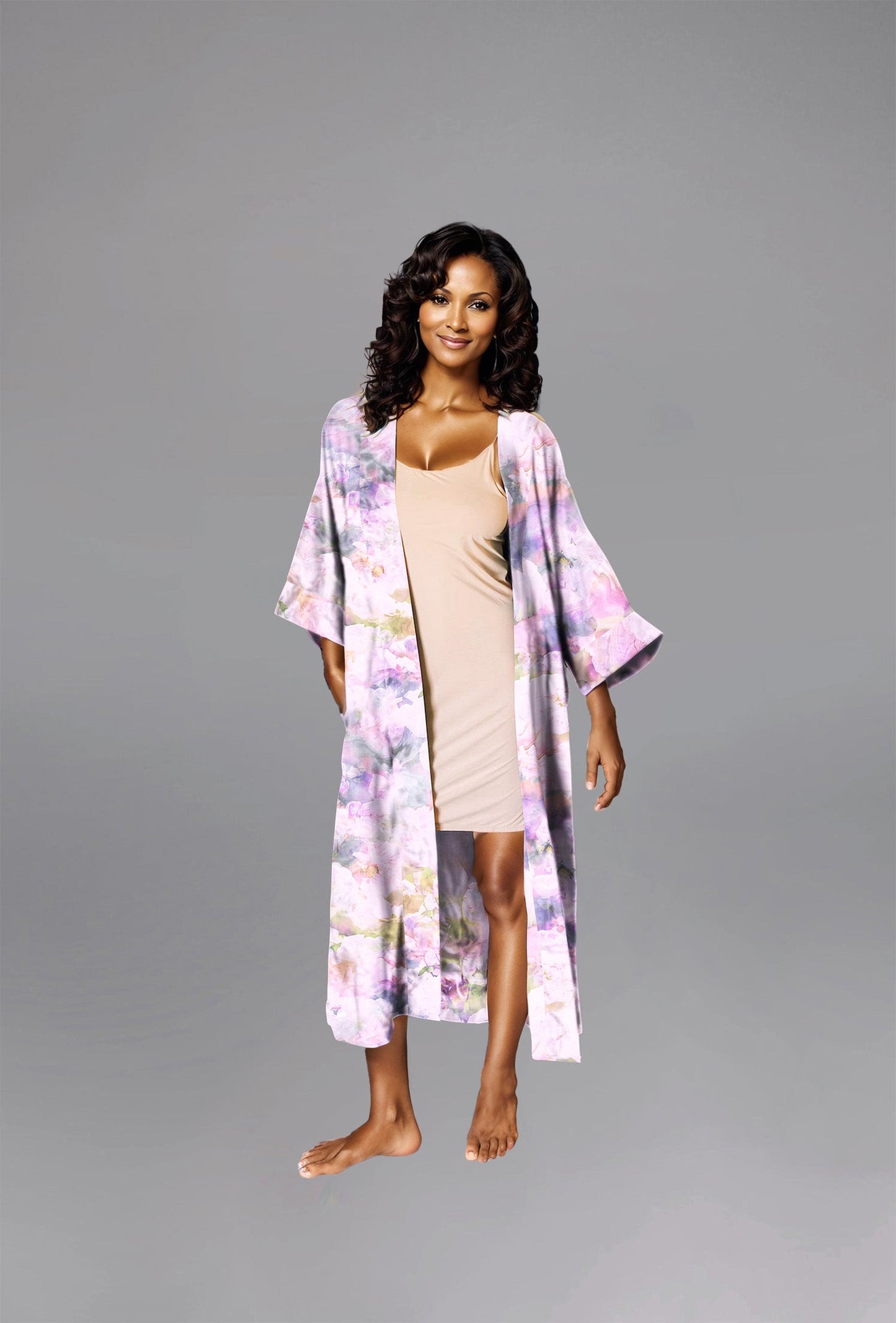 Woman wearing kimono robe in Pink Poppy robe open overtop a nude slip dress