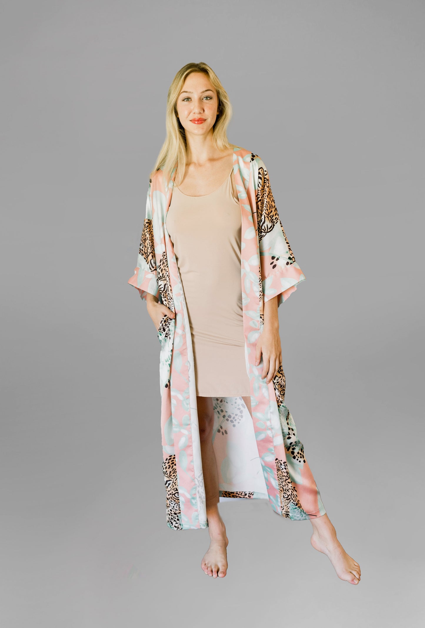 Woman wearing kimono robe in Valencia front view robe open overtop a nude slip dress