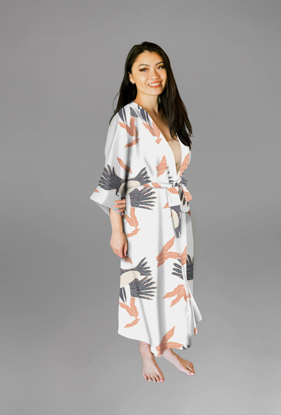 Woman wearing kimono robe in White Toucans side profile view robe closed