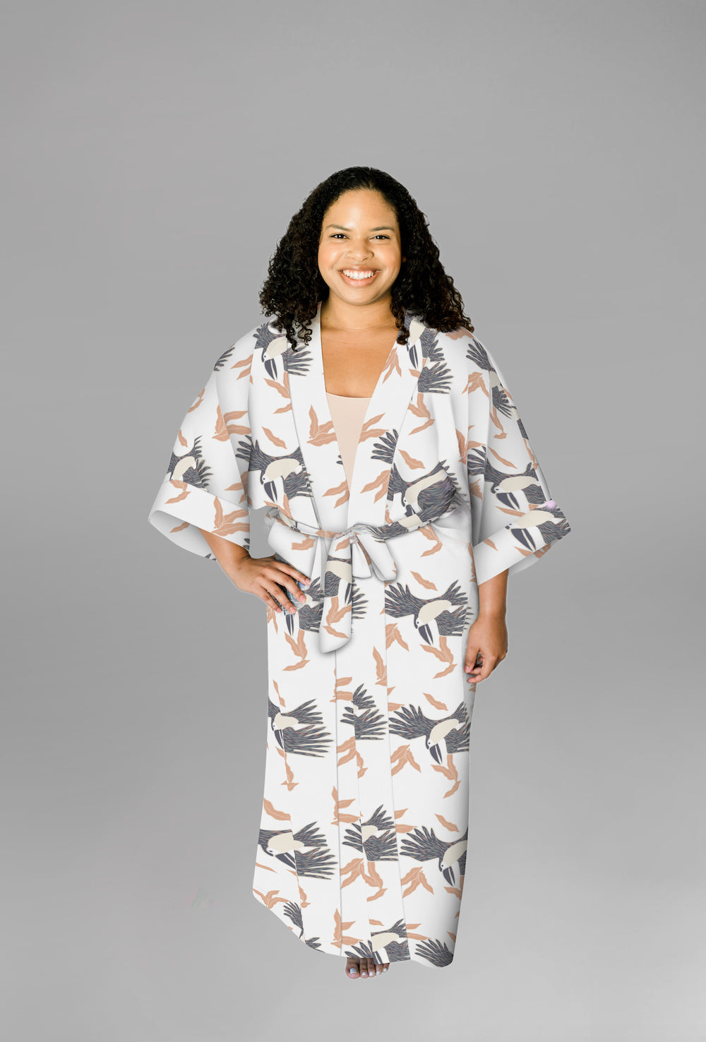 Woman wearing kimono robe in White Toucans with hand at her side