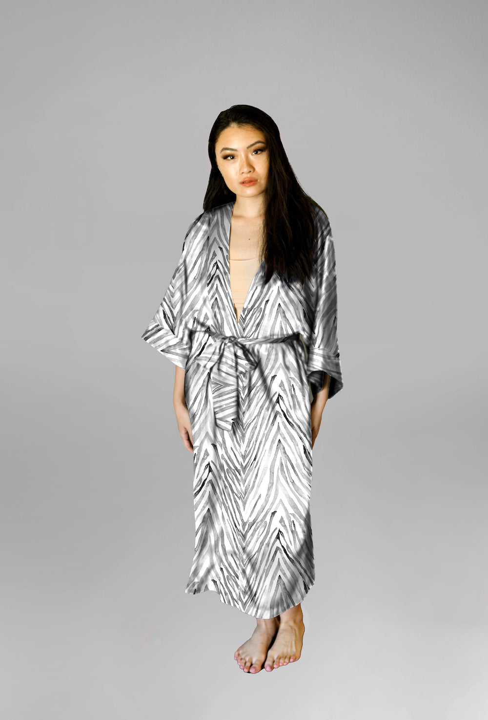 Woman wearing kimono robe in Zebra front profile view