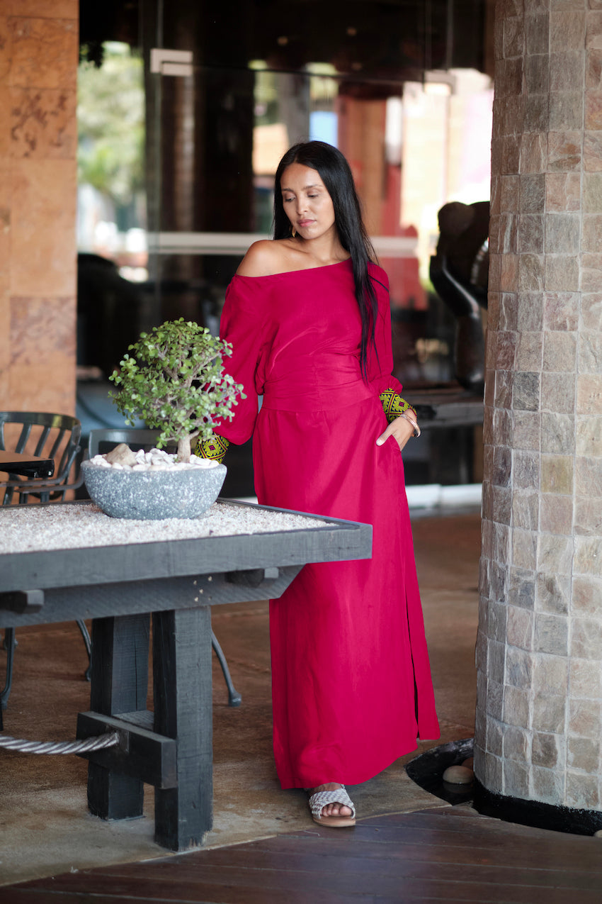 woman modelling a magenta kaftan duster with embroidered sleeves made from recycled materials 2