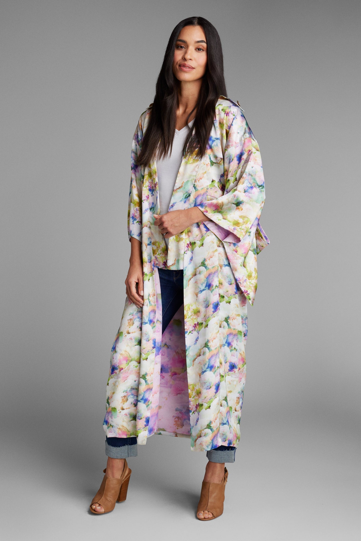 Front profile of woman wearing an all over floral printed kimono duster made from recycled textiles