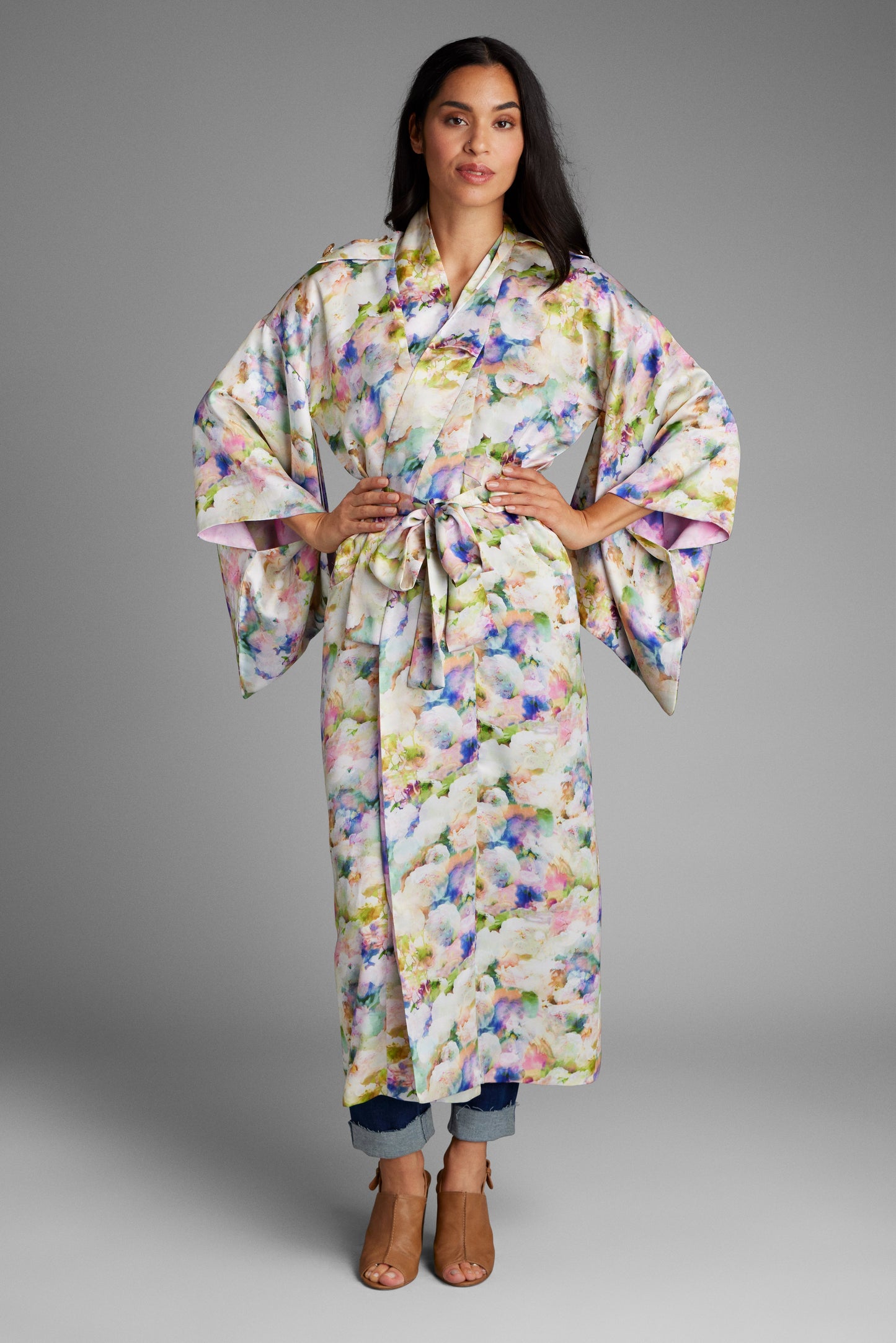 Front profile of woman wearing an all over floral printed kimono duster made from recycled textiles 3