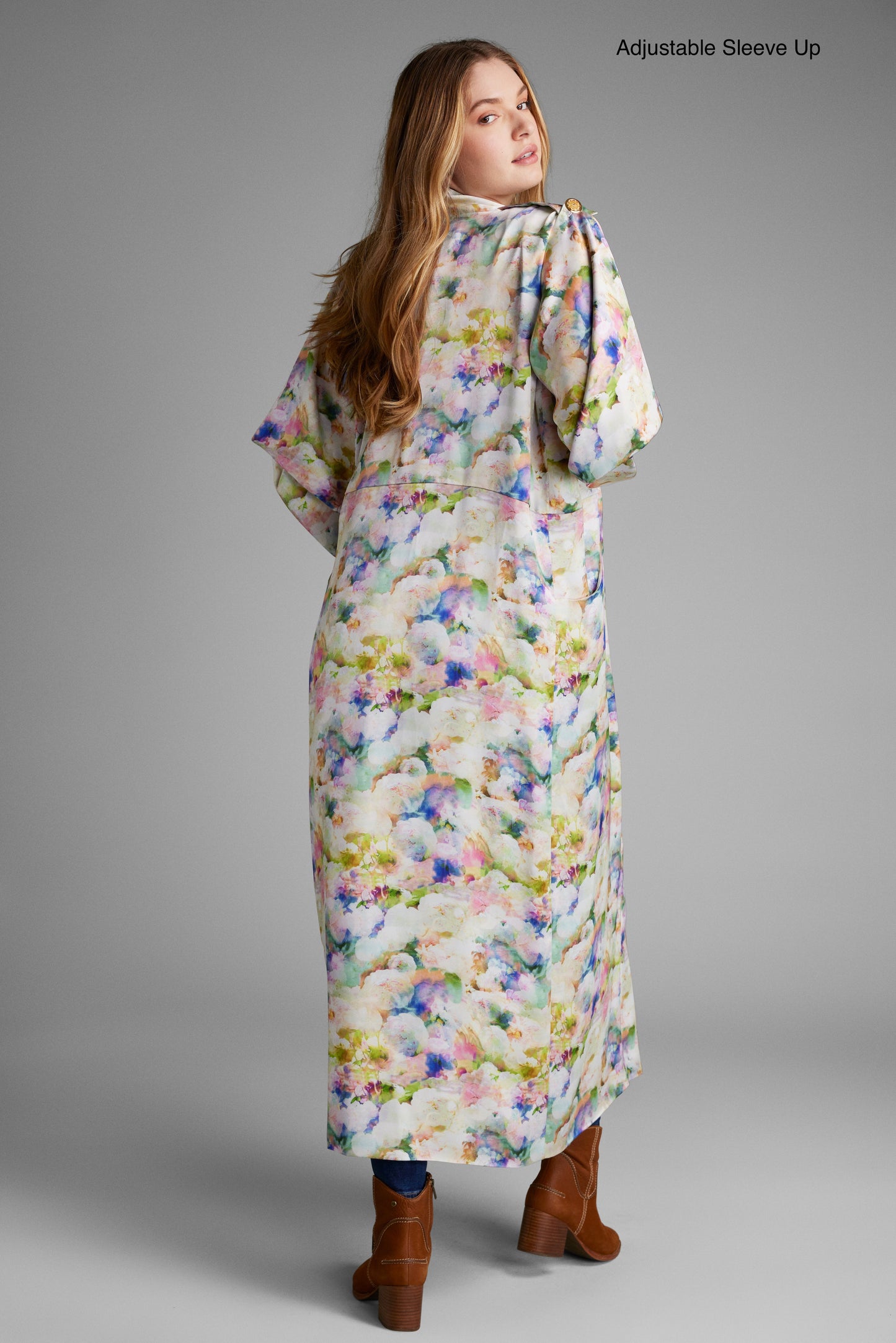 Back profile of woman modelling a long all over floral printed kimono duster made from recycled materials 2