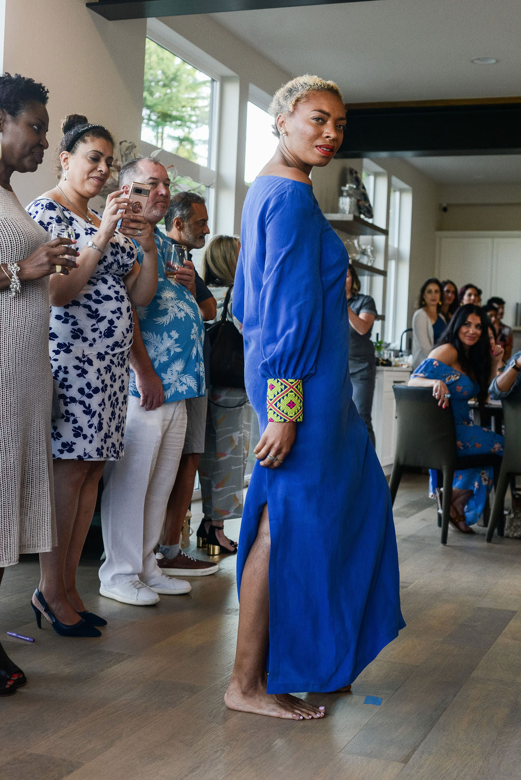 woman modelling a royal blue kaftan duster with embroidered sleeves made from recycled materials 2