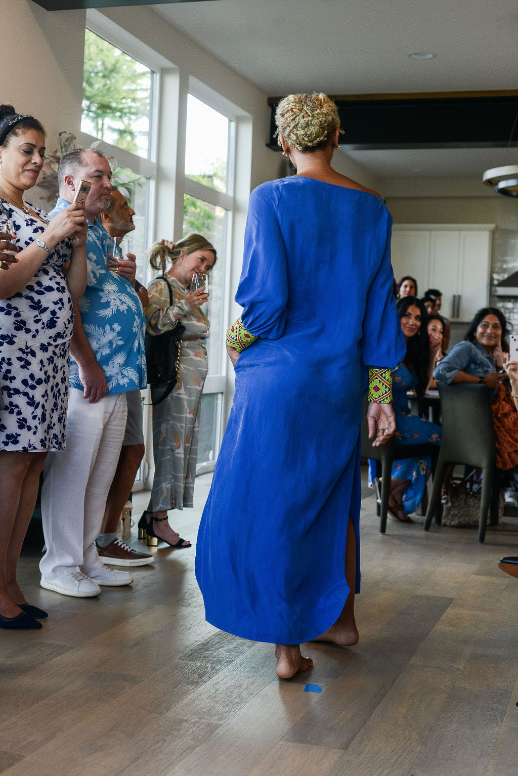 woman modelling a royal blue kaftan duster with embroidered sleeves made from recycled materials 3