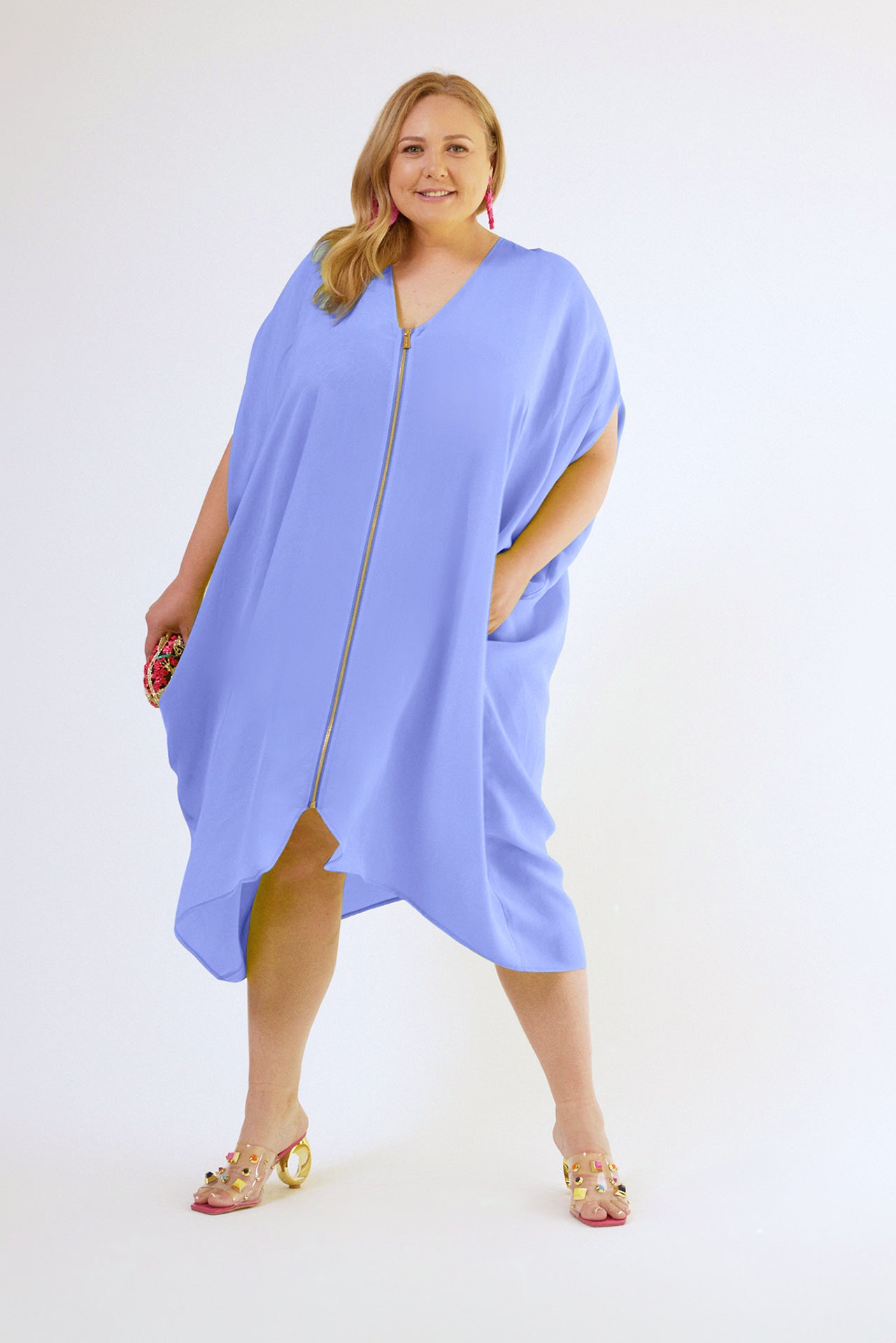 woman modelling a lavender kaftan duster with front zipper made from recycled materials 4