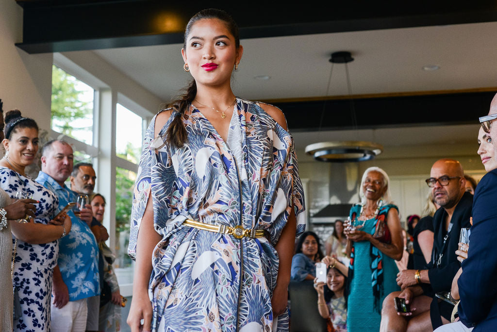 model wearing grey yellow and white all over tropical print kaftan duster with zipper made from recycled textiles 2