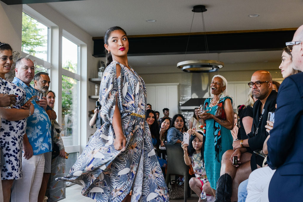 model wearing grey yellow and white all over tropical print kaftan duster with zipper made from recycled textiles