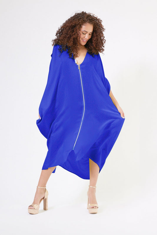 front profile view of woman wearing royal blue kaftan duster with front zipper made from recycled materials