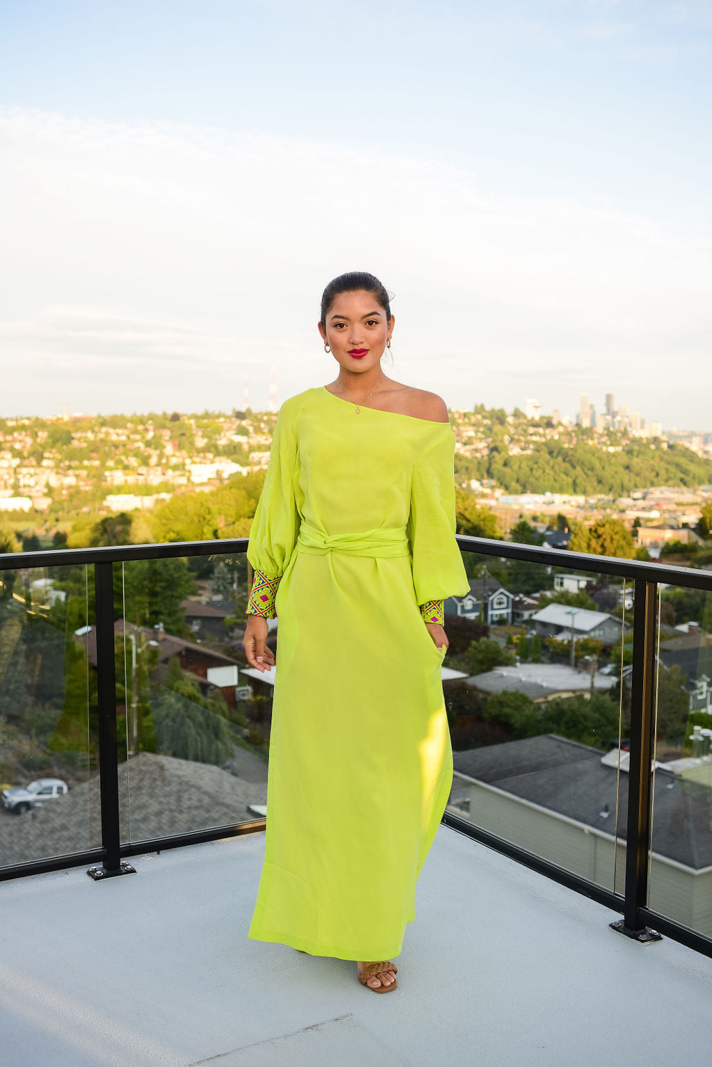 woman modelling a bright yellow kaftan duster with embroidered sleeves made from recycled materials 6