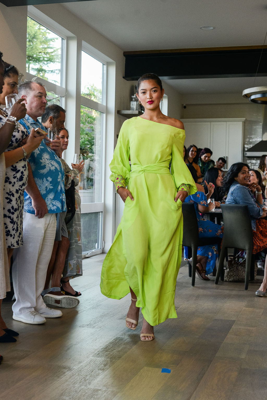 woman modelling a bright yellow kaftan duster with embroidered sleeves made from recycled materials 3