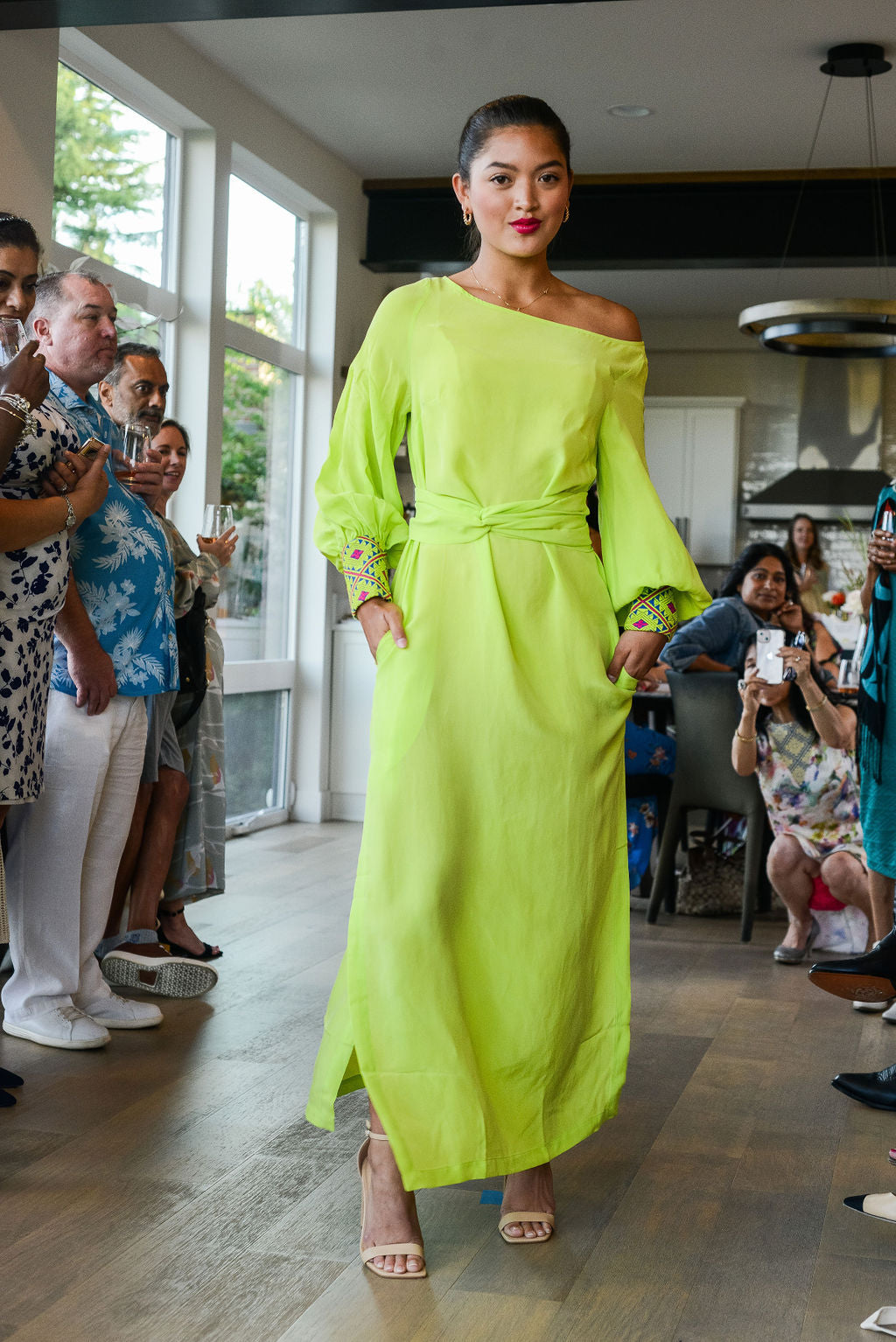 woman modelling a bright yellow kaftan duster with embroidered sleeves made from recycled materials 5