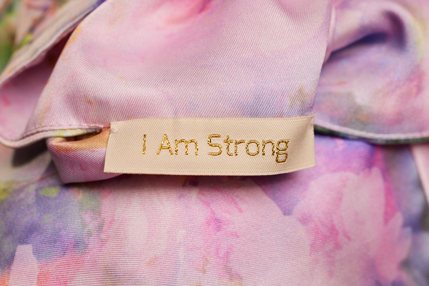 Close up view of kimono robe tag in Pink Poppy