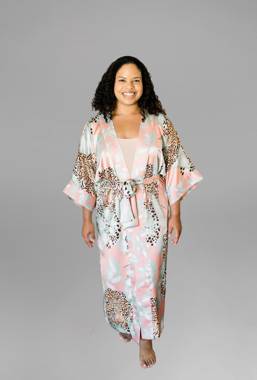 Woman wearing kimono robe in Valencia front view with hands at her side
