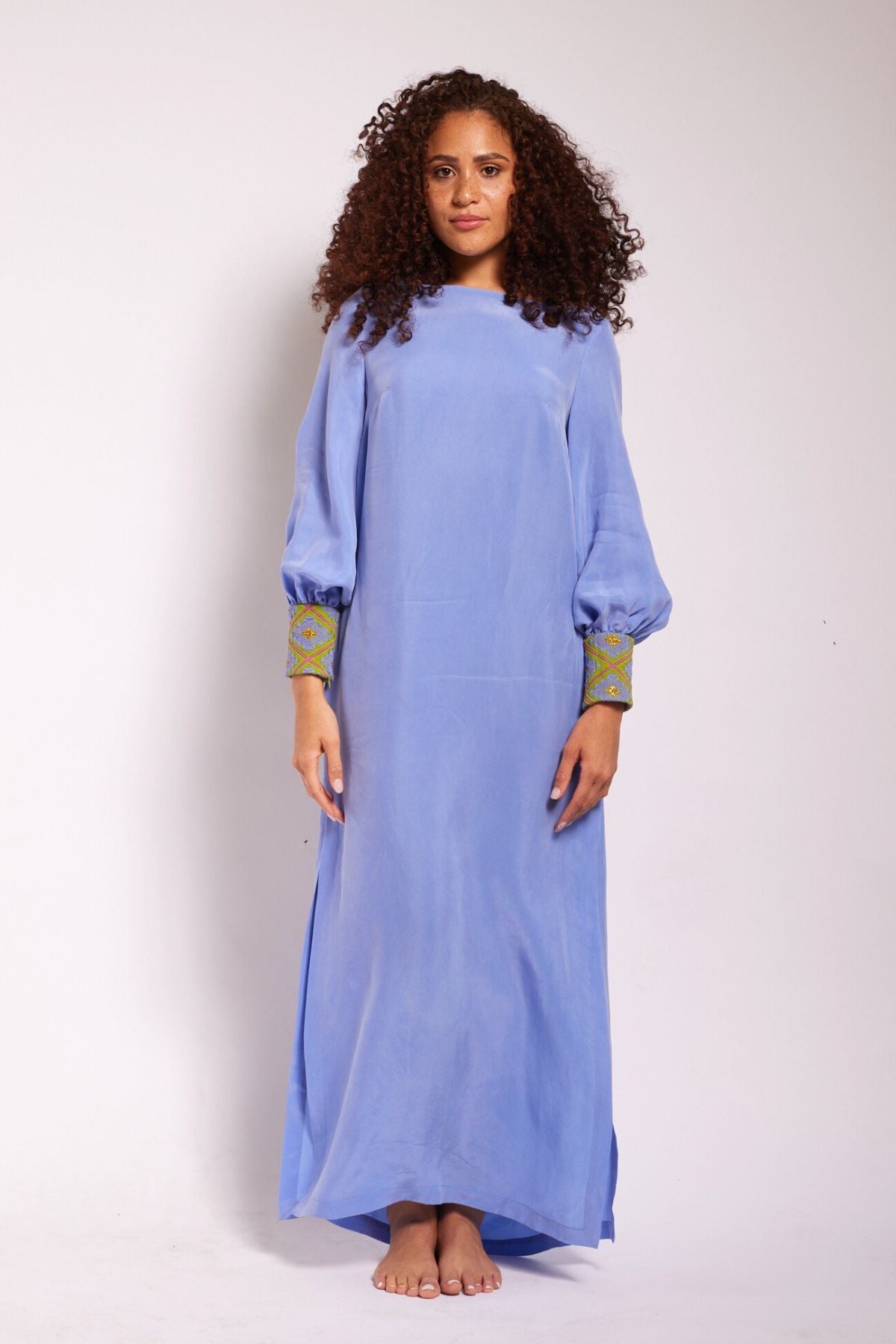 front view of woman wearing lavender kaftan duster with embroidered sleeves made from recycled materials 3