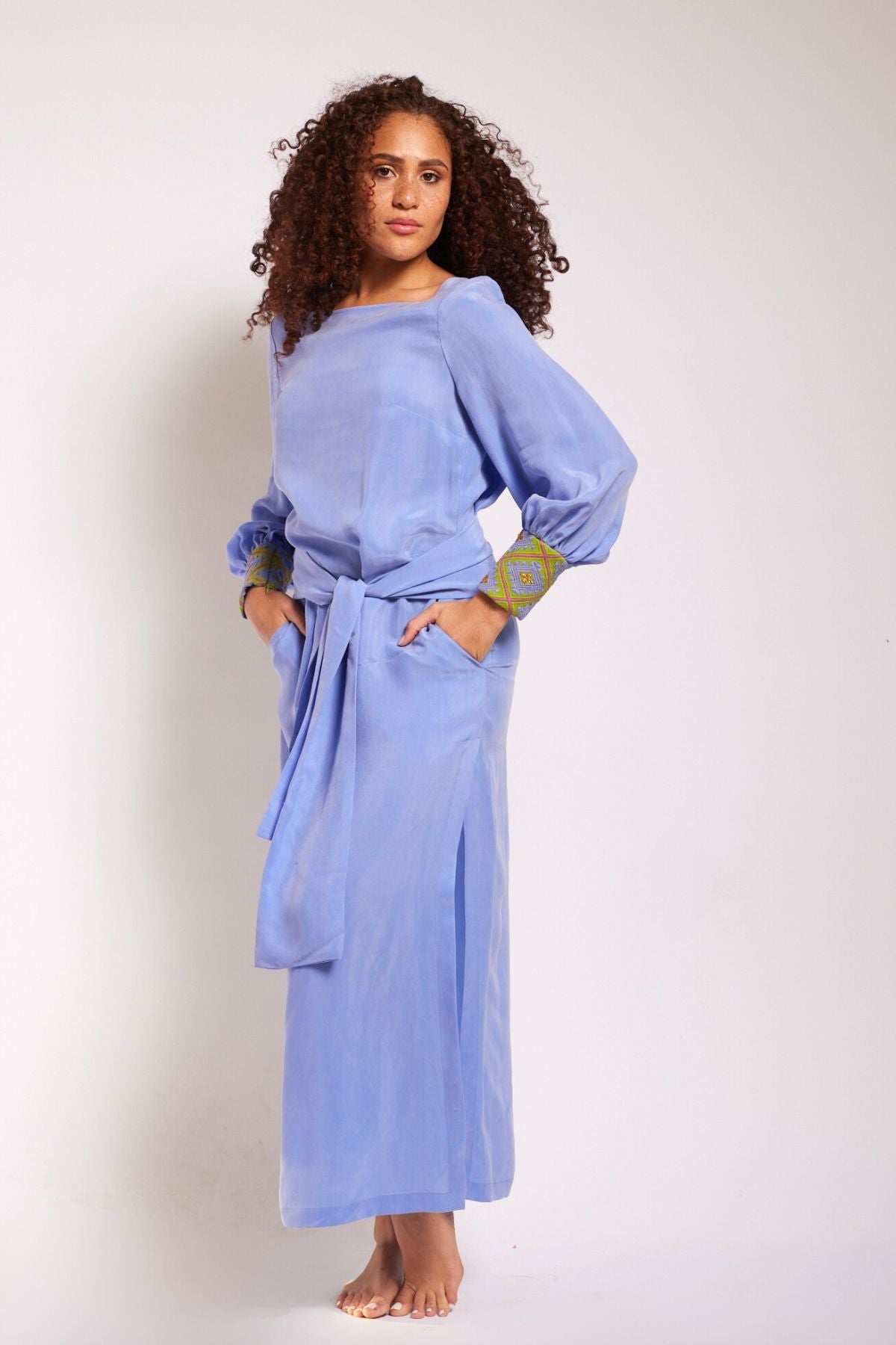 front view of woman wearing lavender kaftan duster with embroidered sleeves made from recycled materials 2