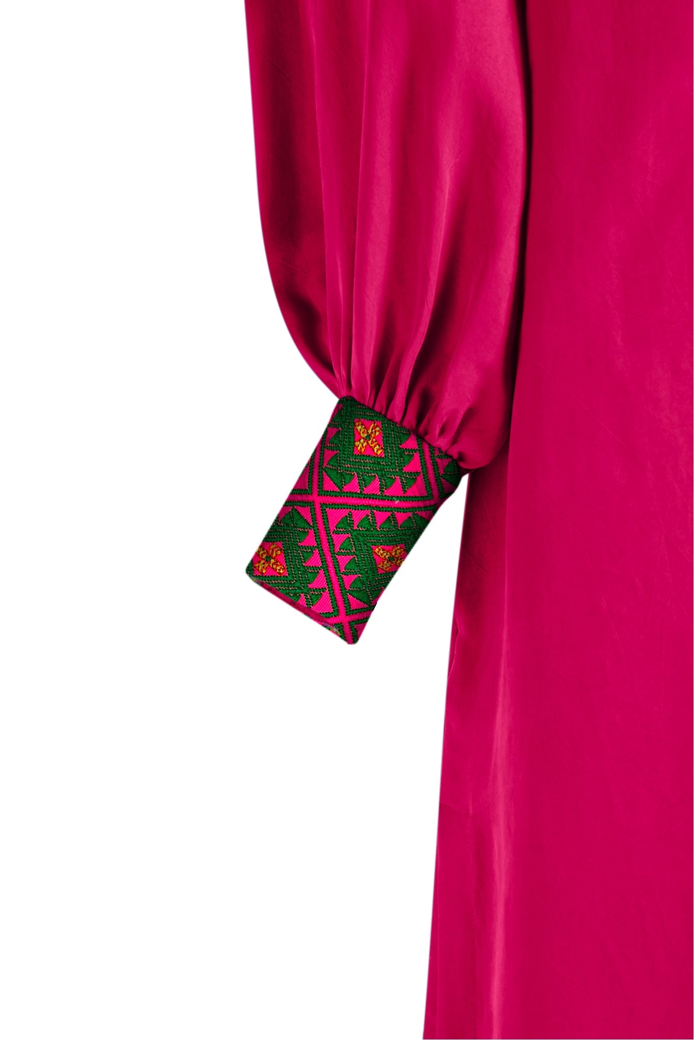 close up view of woman wearing a magenta kaftan duster with embroidered sleeves made from recycled materials 3