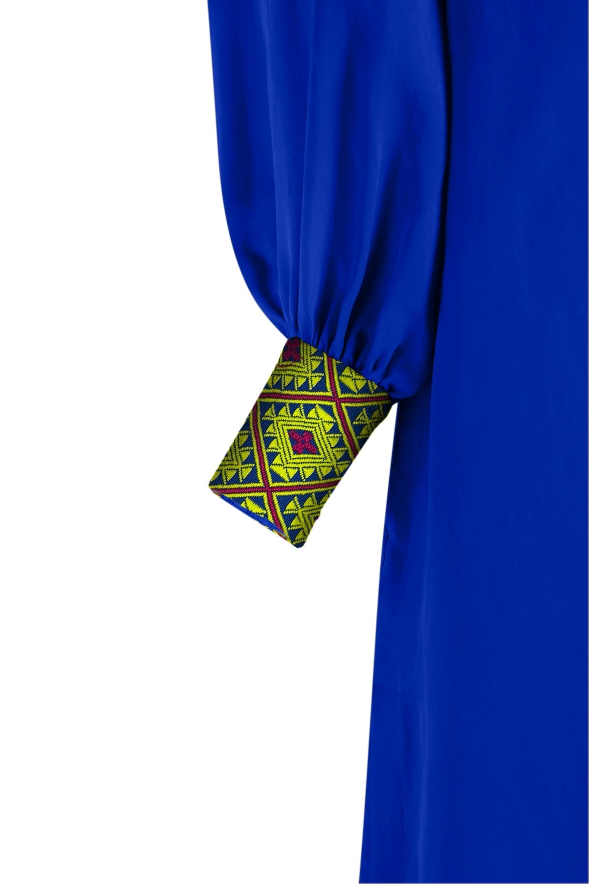 close up view of royal blue kaftan duster with embroidered sleeves made from recycled materials
