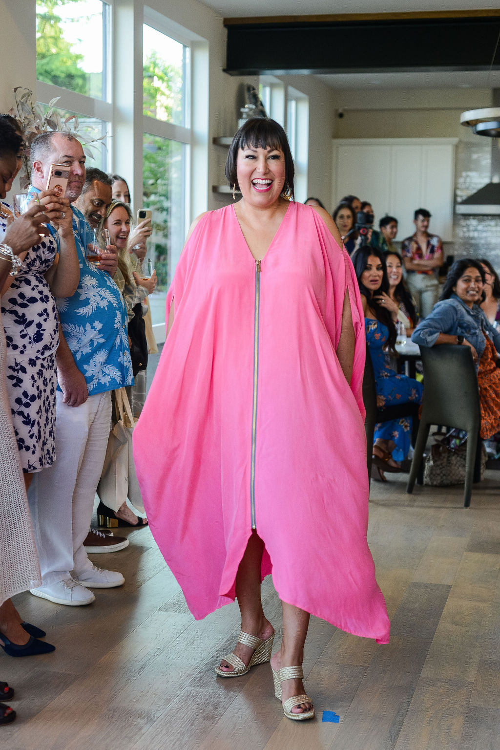woman modelling wearing bubble gum pink kaftan duster with front zipper made from recycled materials 2