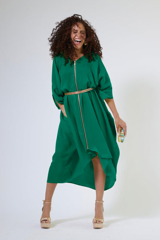 woman wearing green kaftan duster with front zipper with hand in her pocket