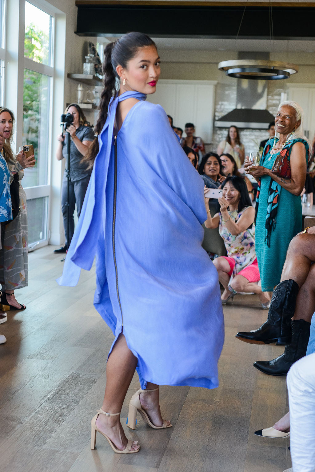 woman modelling a lavender kaftan duster with front zipper made from recycled materials 2