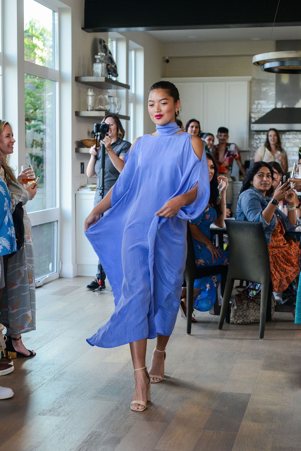 woman modelling a lavender kaftan duster with front zipper made from recycled materials 3