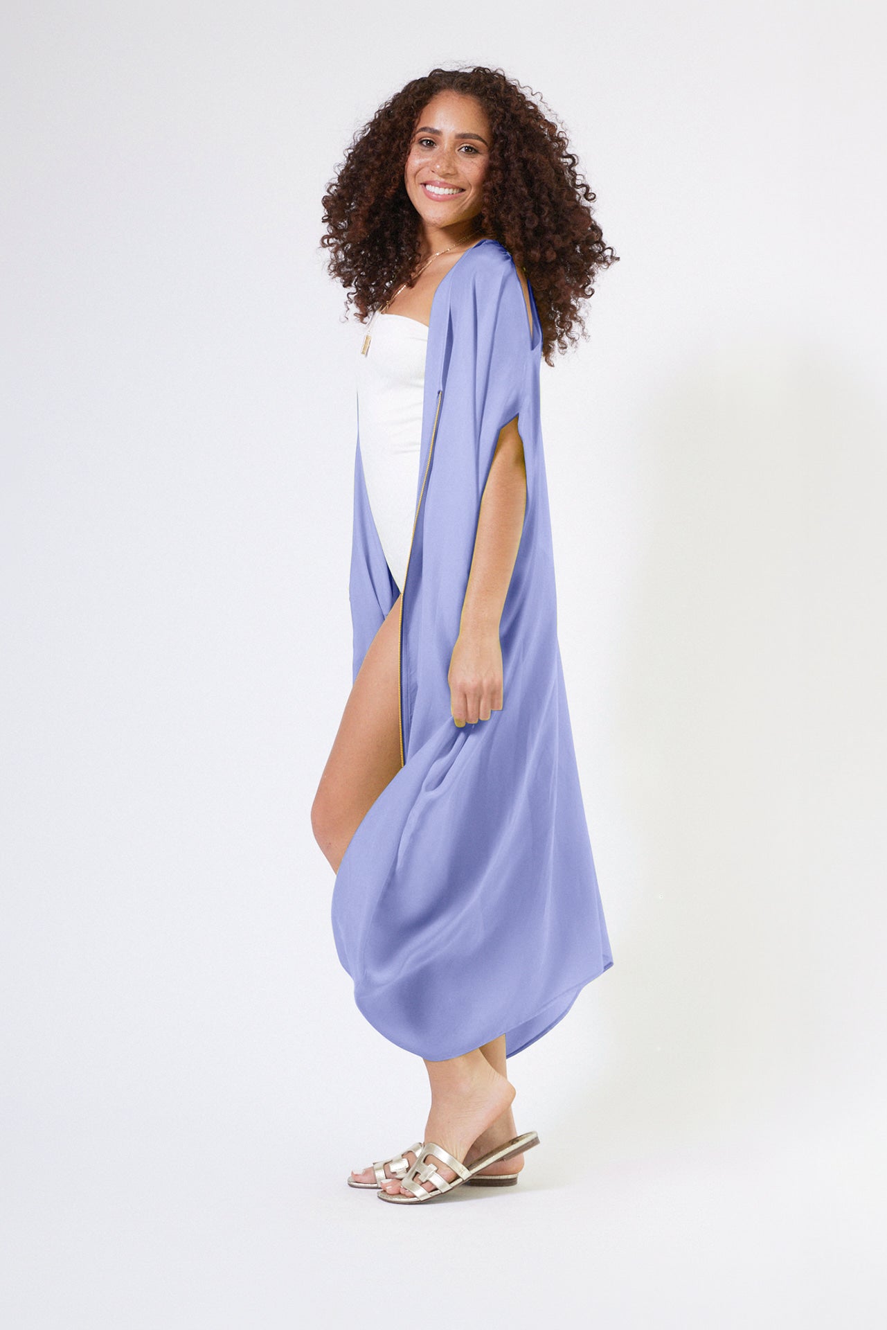 woman modelling a lavender kaftan duster with front zipper made from recycled materials 4