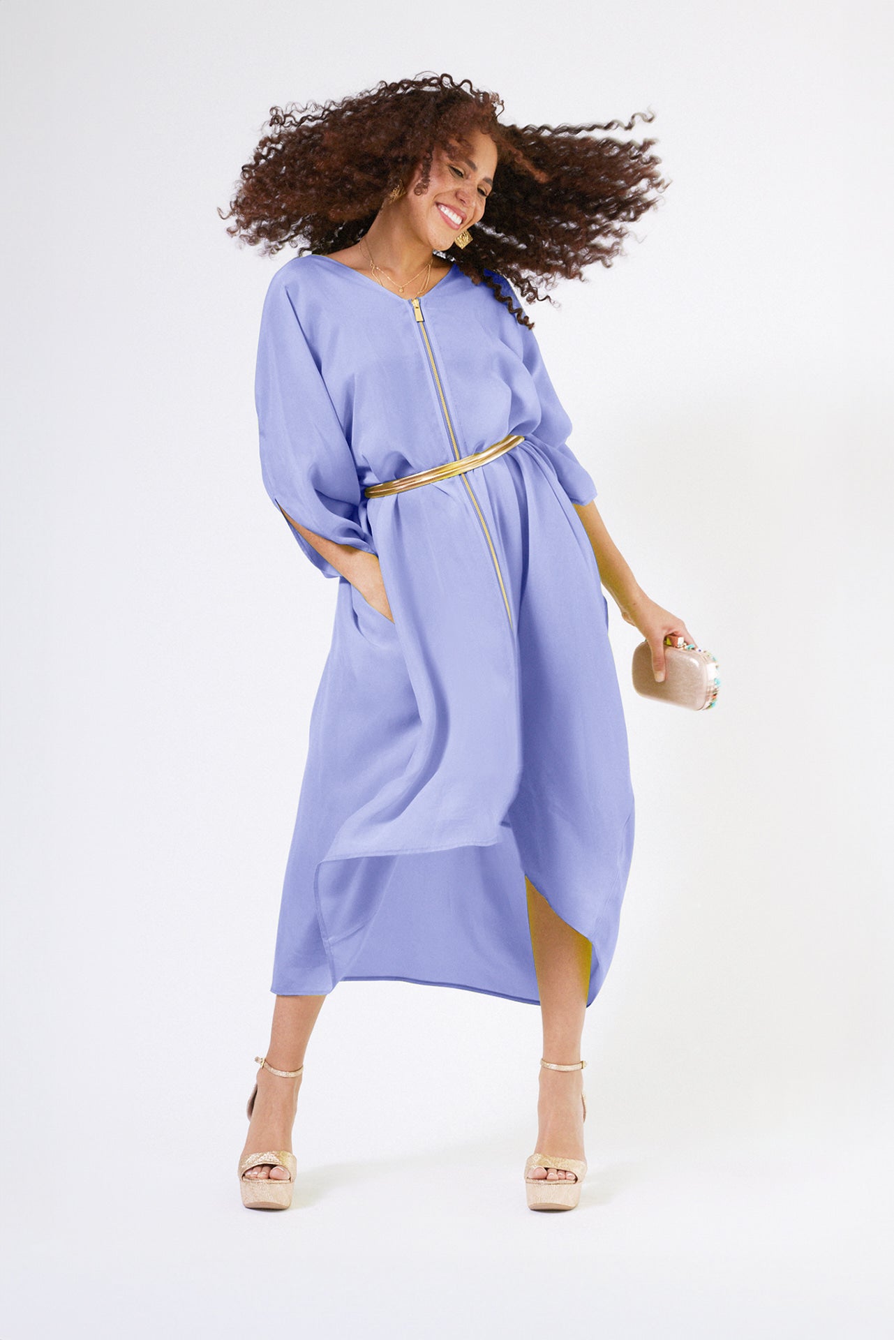 woman modelling a lavender kaftan duster with front zipper made from recycled materials 3