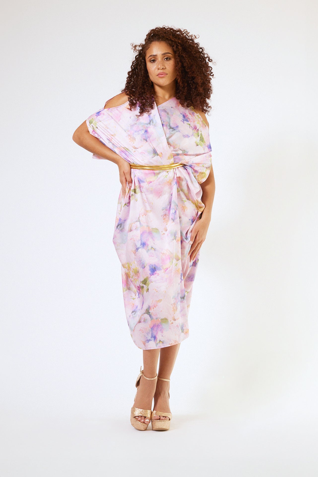 front profile of woman modelling pink floral kaftan duster with front zipper made from recycled textiles 2