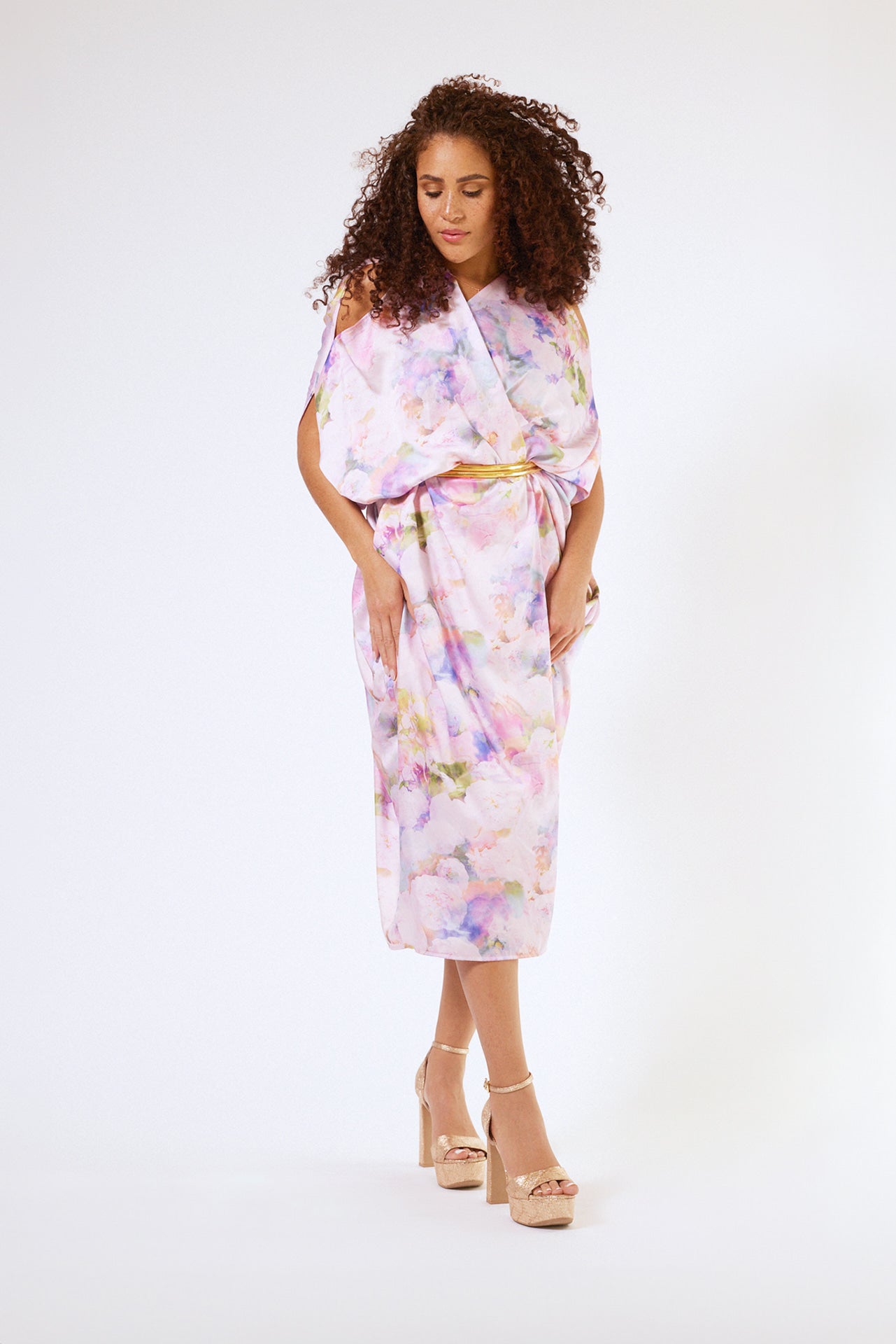 front profile of woman modelling pink floral kaftan duster with front zipper made from recycled textiles 3
