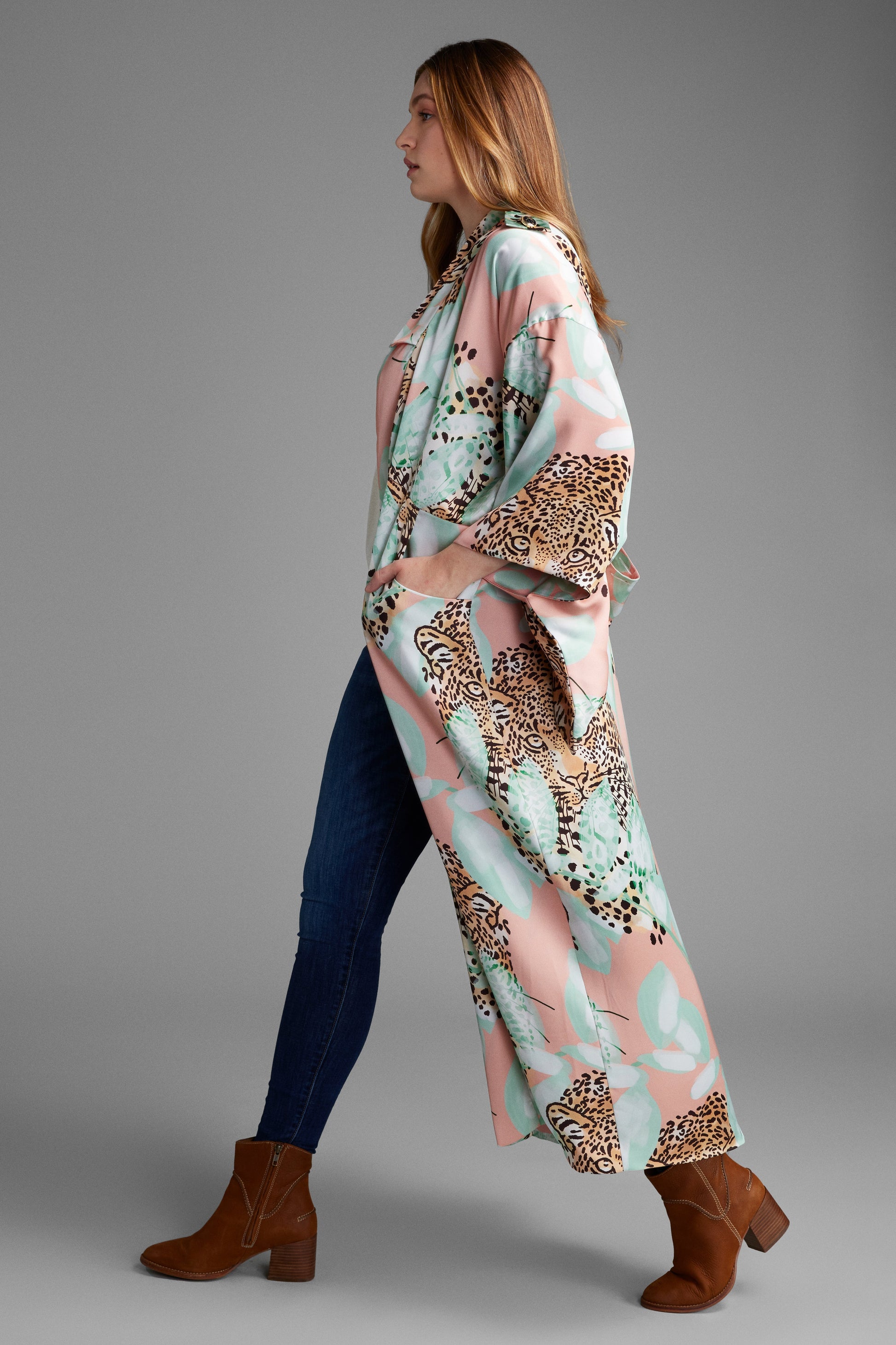 Woman wearing an all over tropical animal print kimono duster made from eco friendly recycled materials