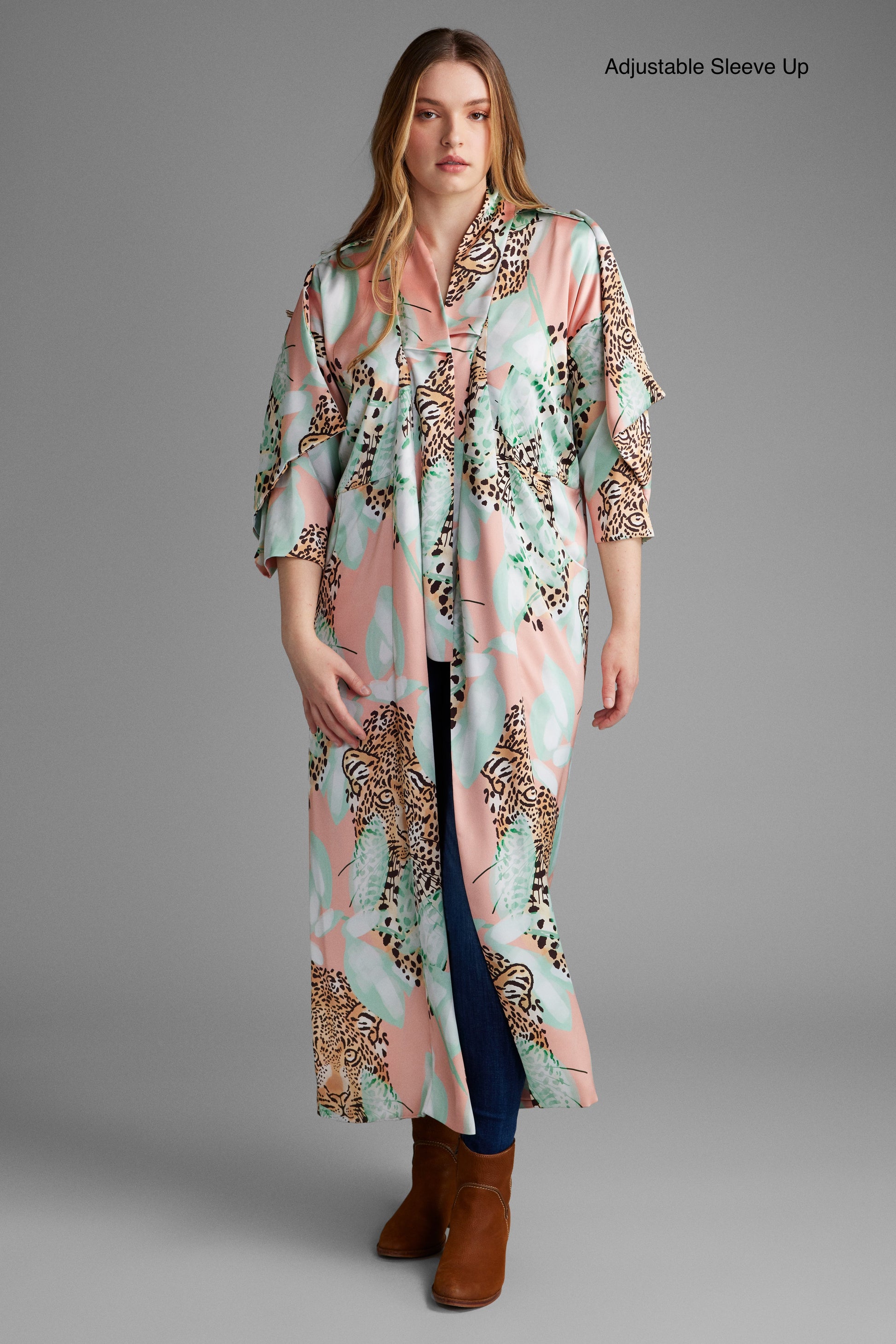 Woman standing wearing an all over tropical animal print kimono duster made from recycled textiles 2