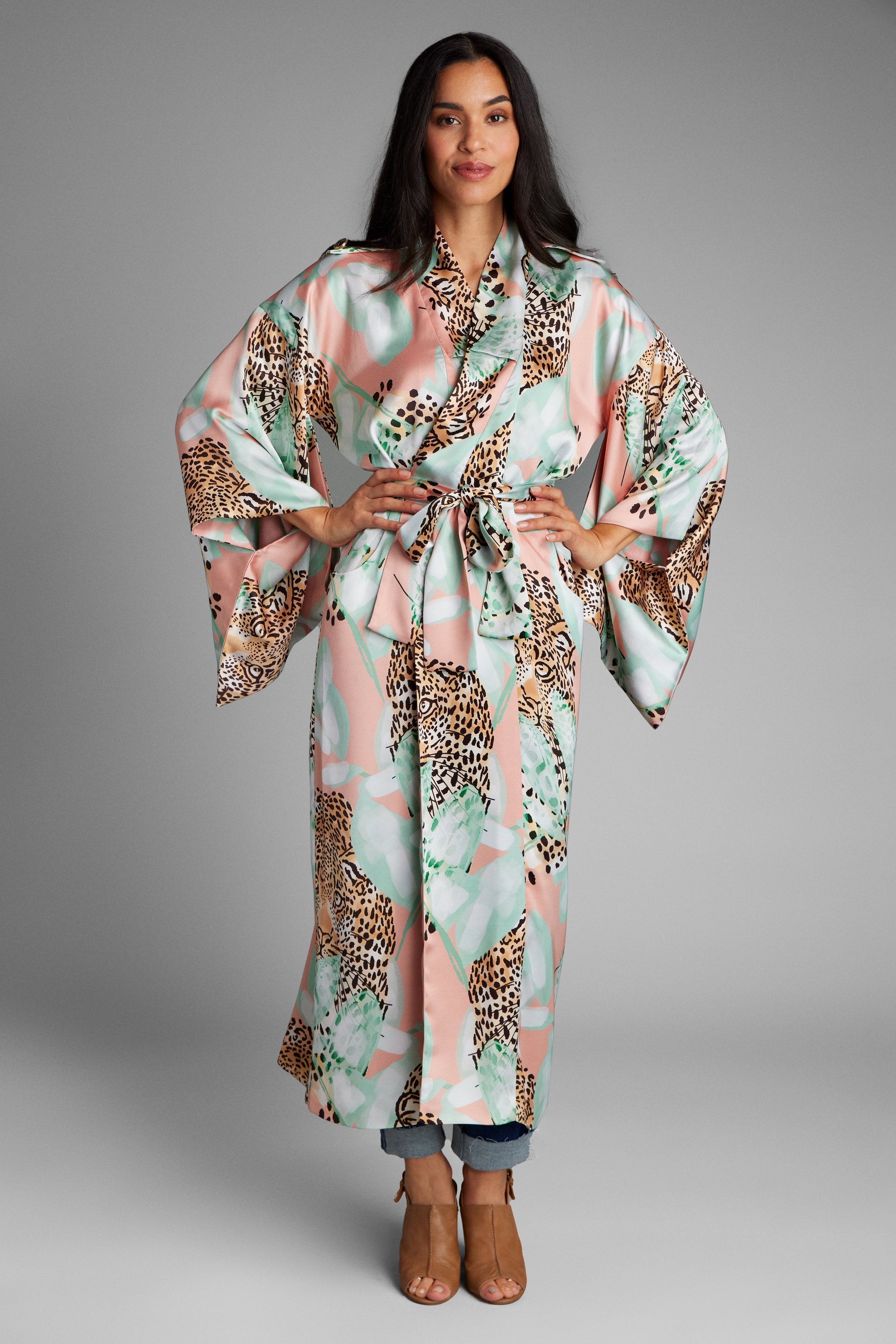 Woman wearing a long all over tropical animal print kimono duster kimono made from recycled materials